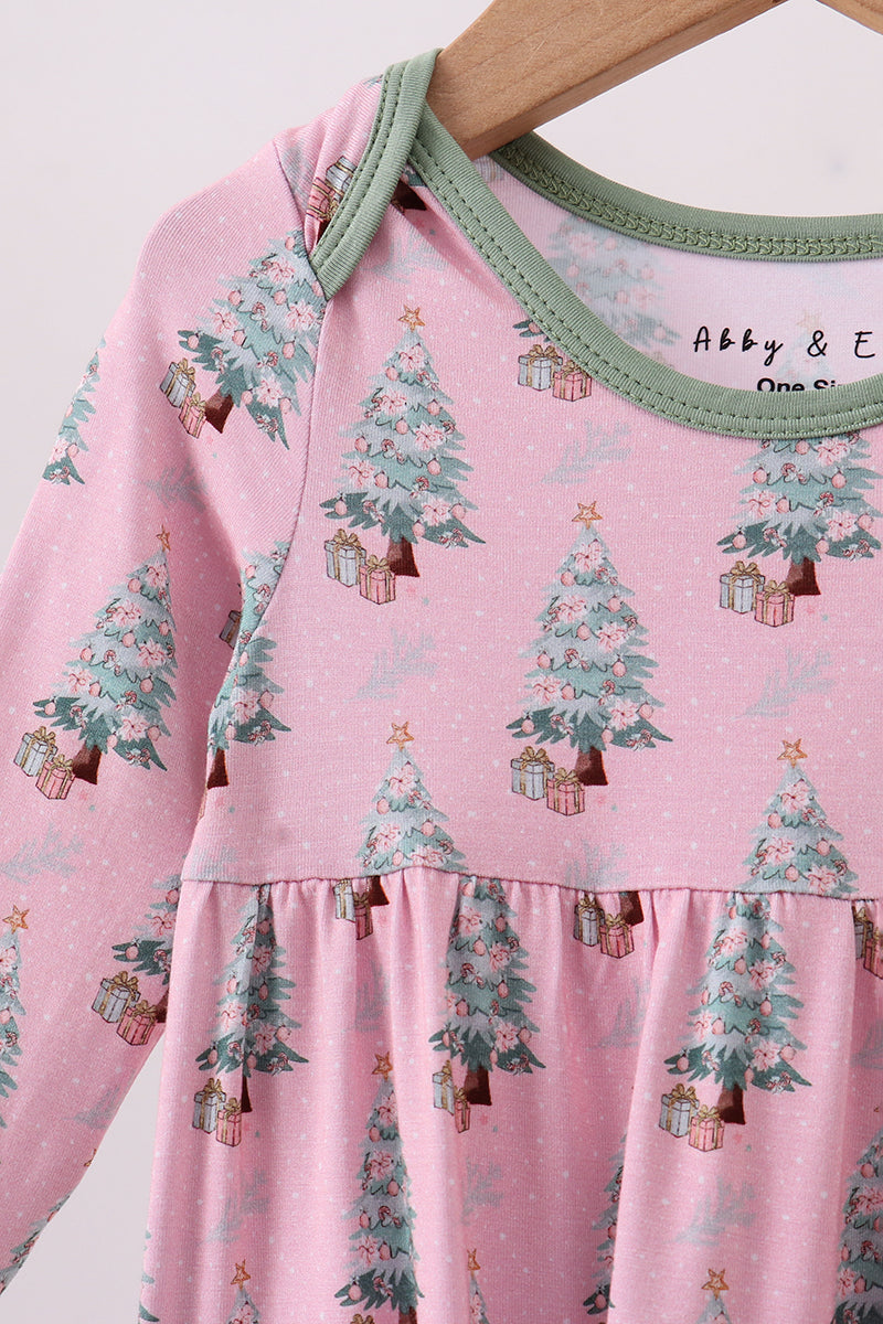 Pink baby dress with Christmas tree pattern on a white background