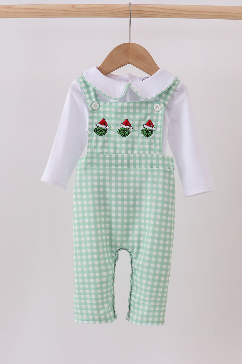 Green checkered baby romper with red hats on a white background