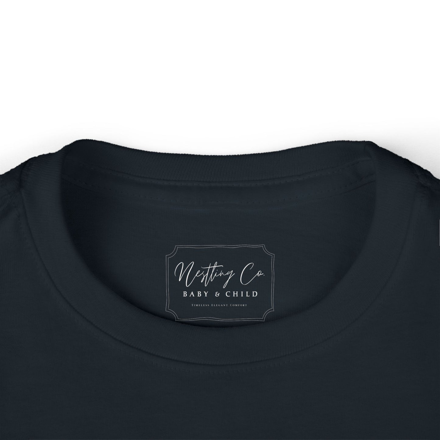 Nesting Co baby & child label on a black garment