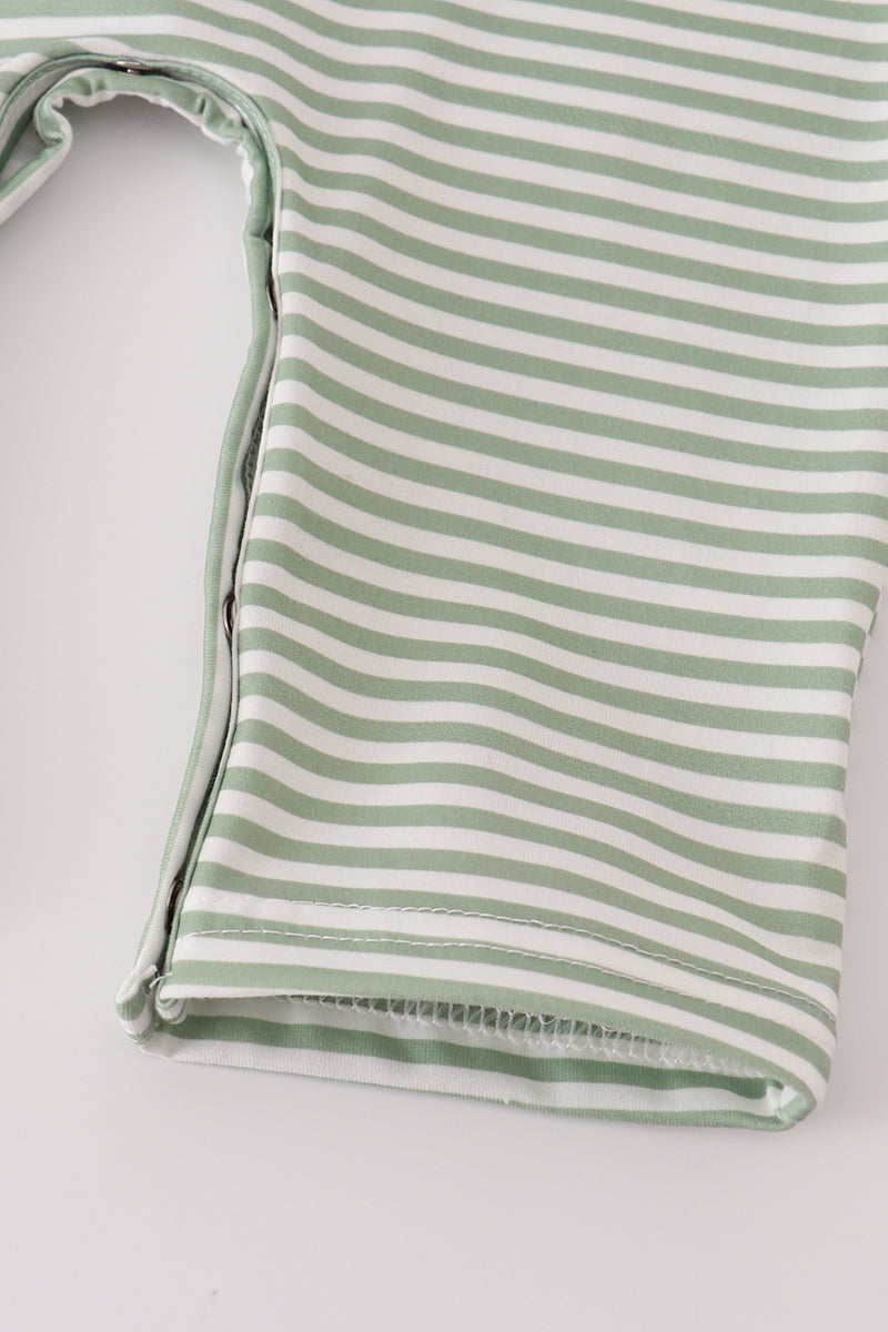 Green and white striped tank top on a light gray background