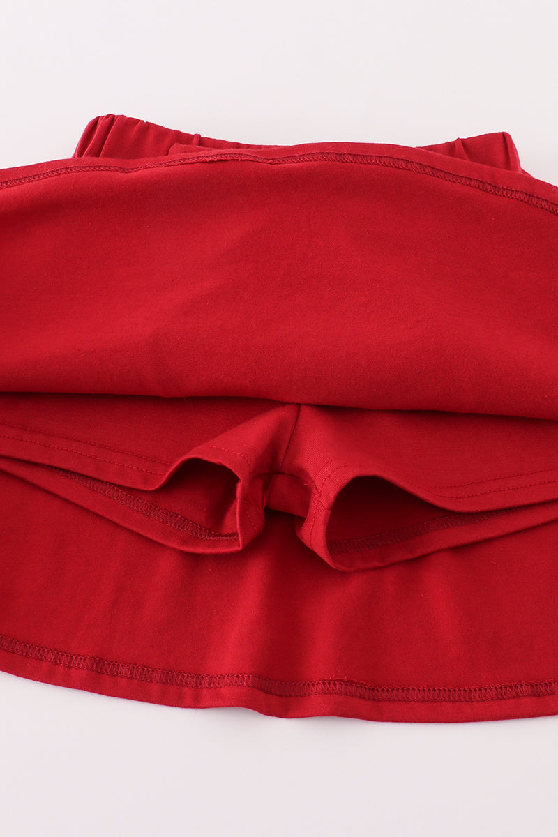 Stack of red fabric on a white background