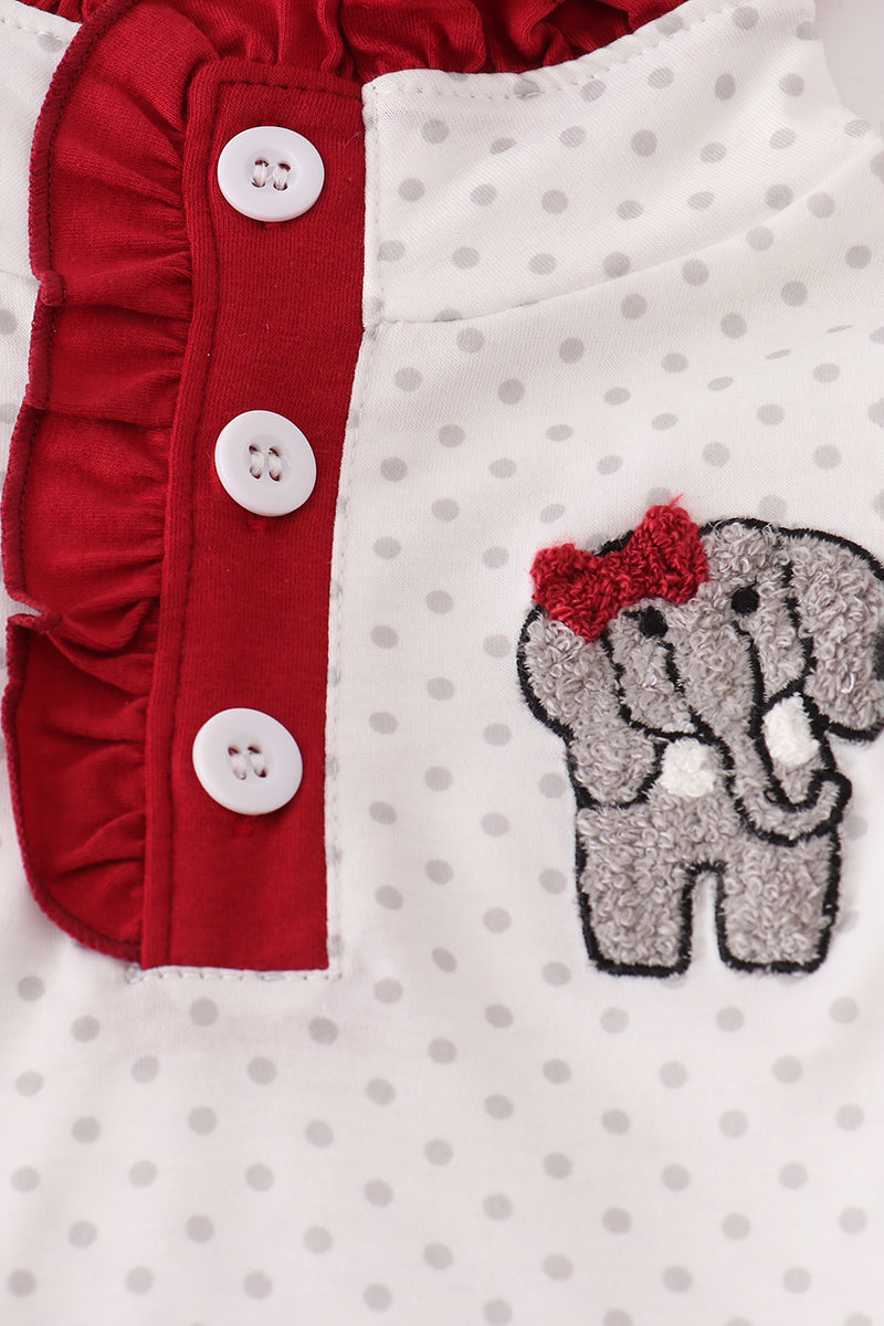 Children's outfit with red ruffled trim and gray elephant with a bow design on a white background.