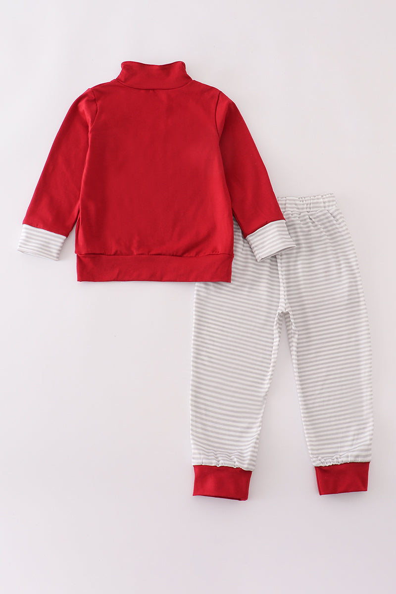 Red jacket and striped pants set on a white background