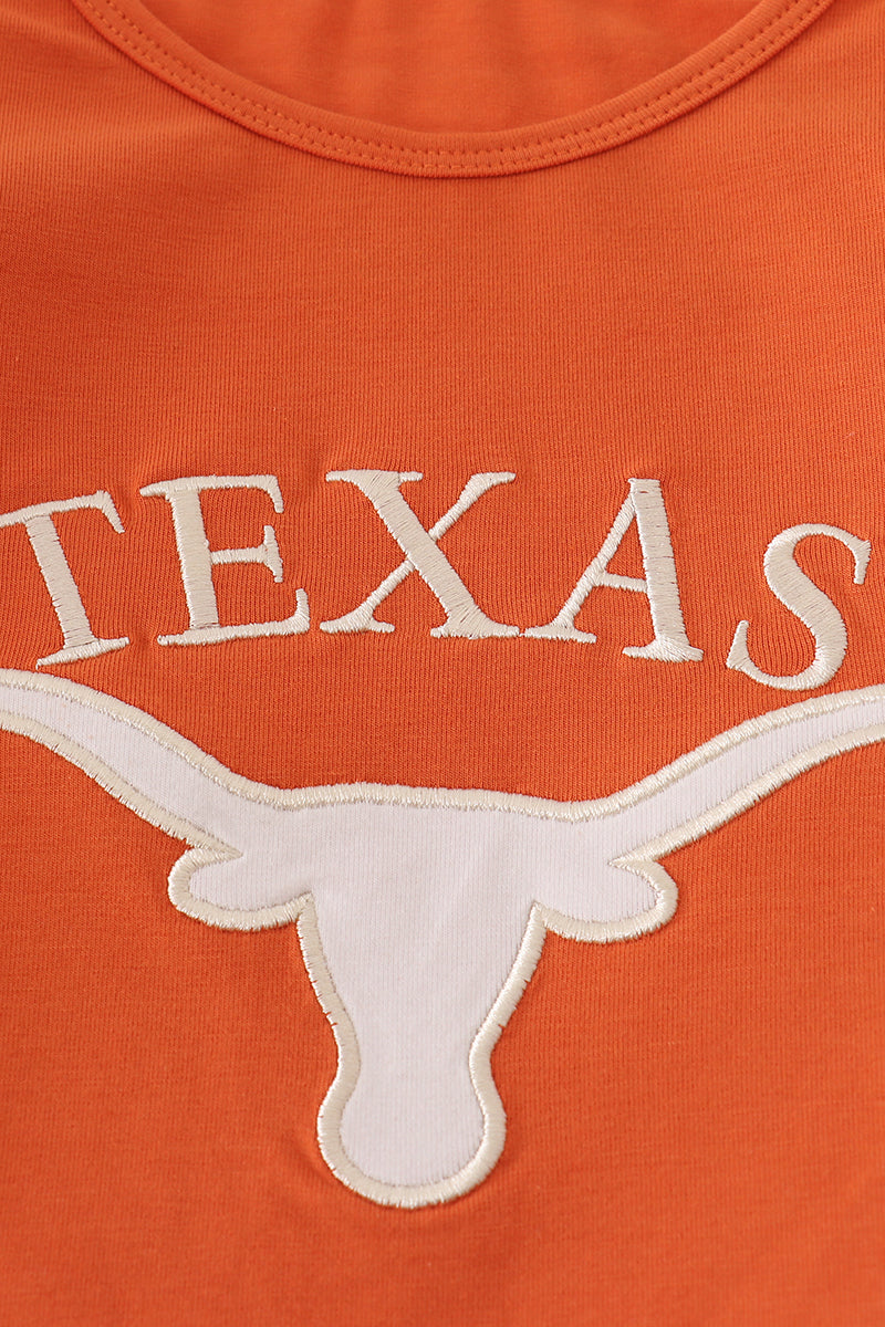 Orange shirt with 'TEXAS' and a longhorn logo on an orange background