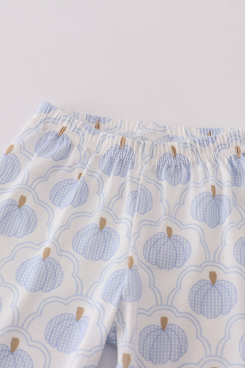 Blue pumpkin patterned fabric on a white background