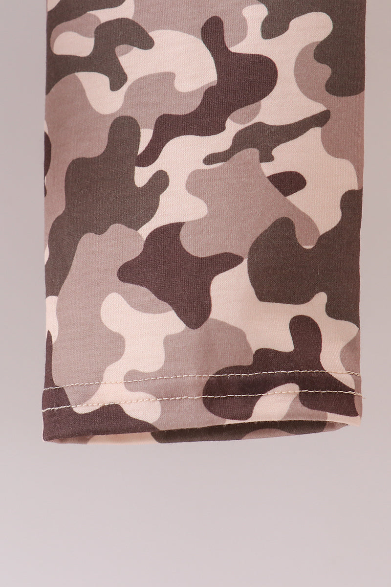 Camouflage-patterned fabric on a plain background