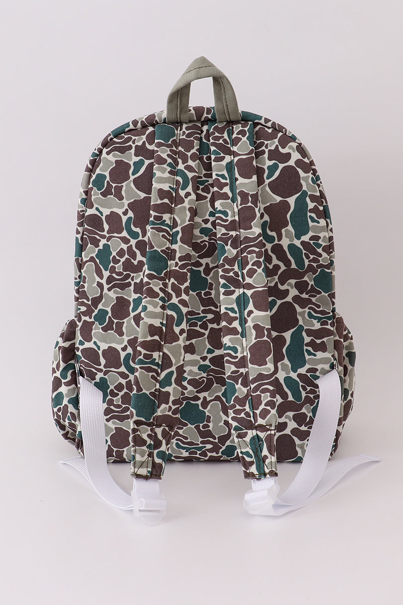 Camouflage-patterned backpack on a white background