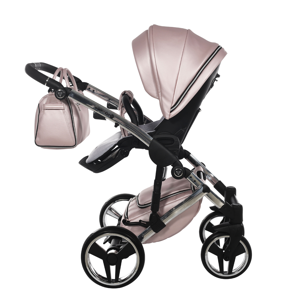 Pink baby stroller with matching bag on a white background