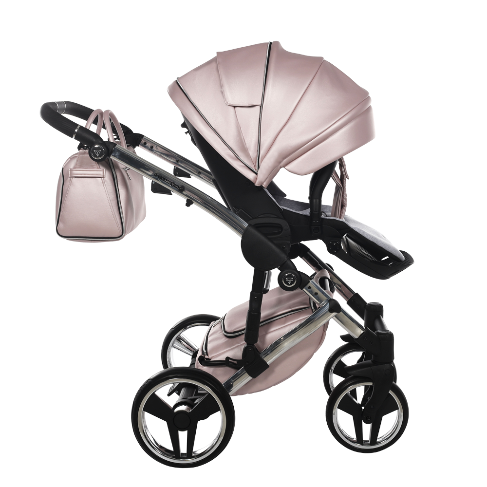 Pink stroller with matching bag on a white background