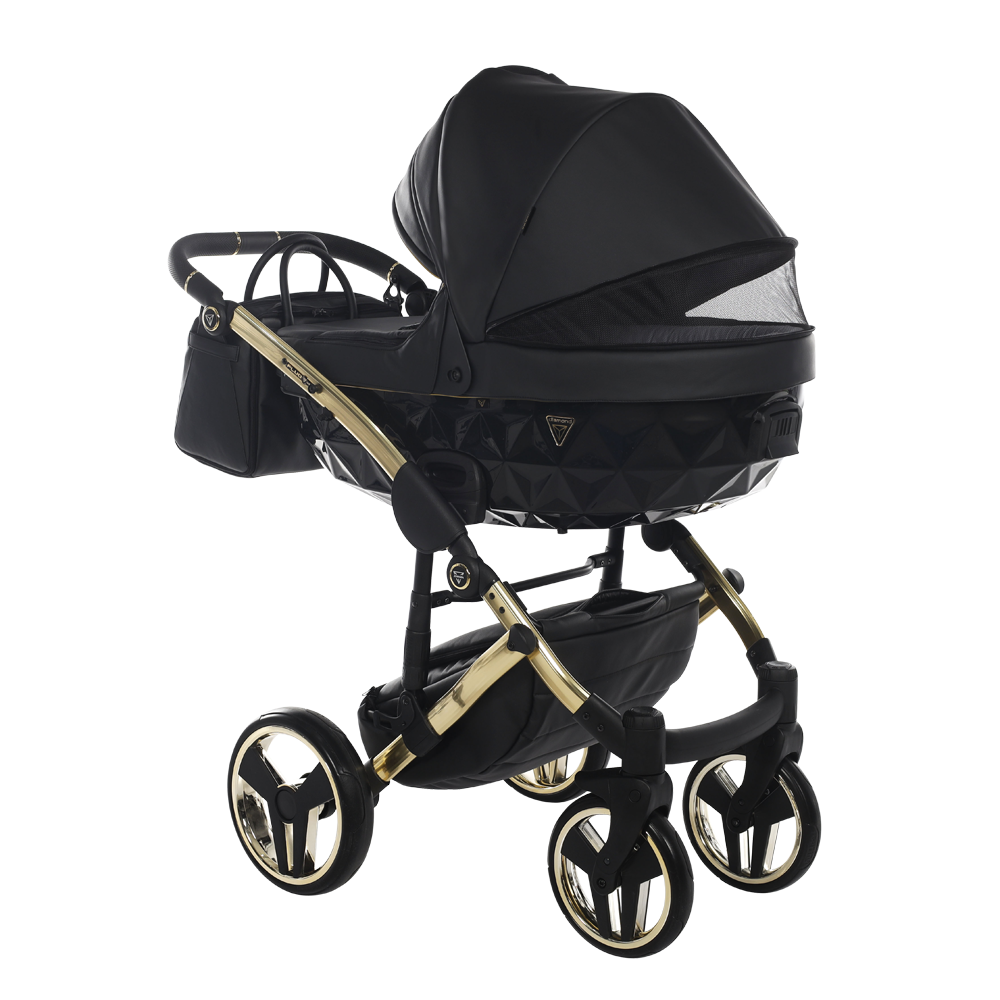 Black and gold baby stroller on a white background