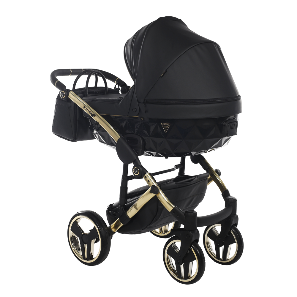 Black and gold baby stroller on a white background