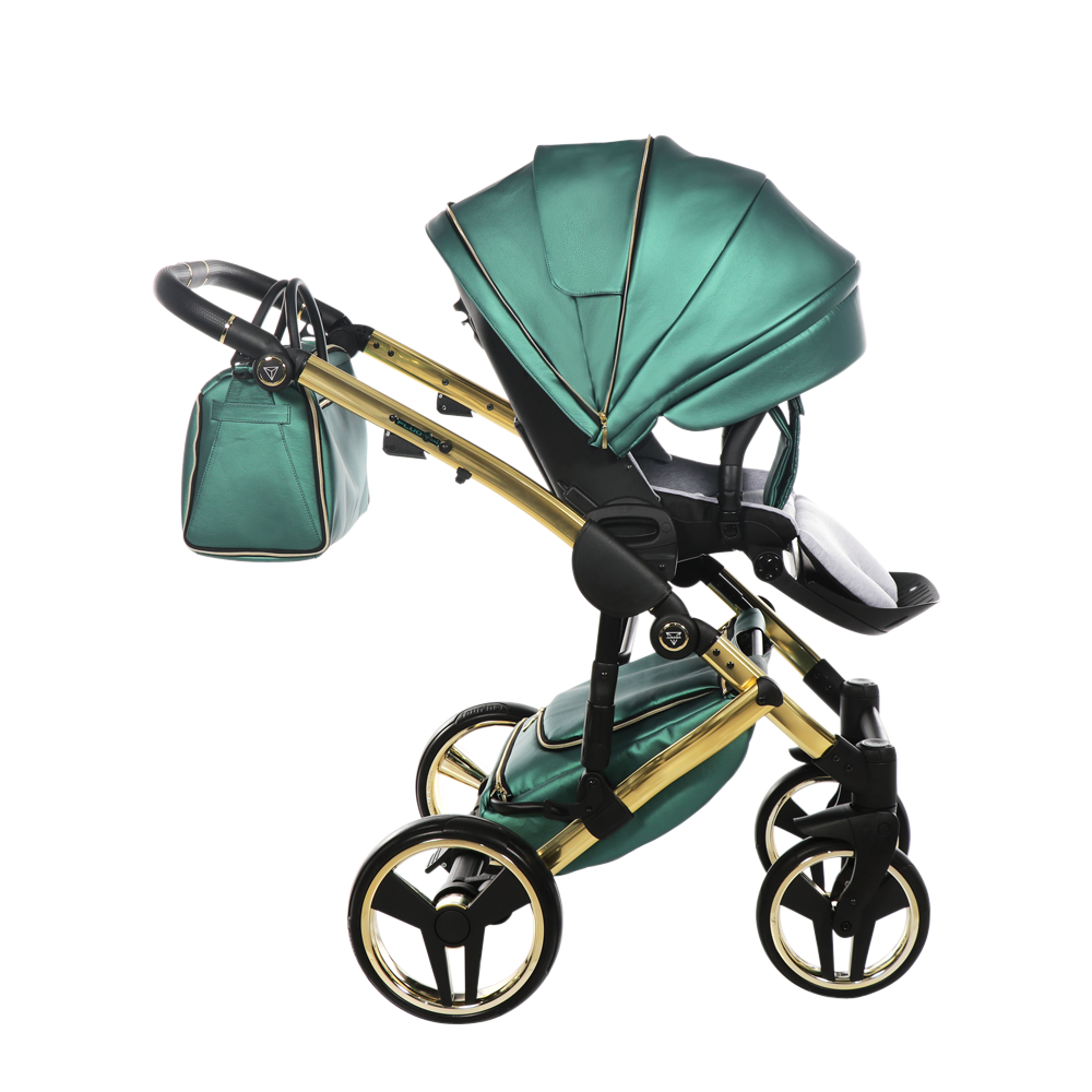 Green and gold baby stroller on a white background