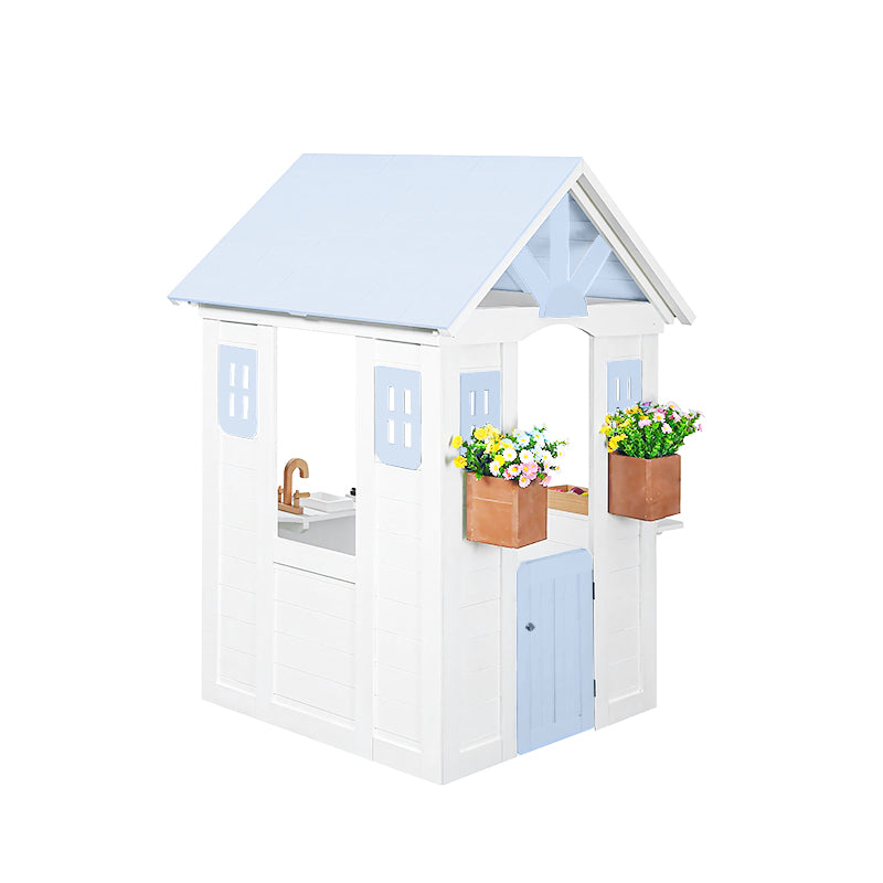 Children's playhouse with a light blue roof and white body, featuring flower boxes and a sink.