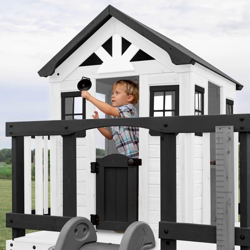 Sweetwater Heights White Cedar Wooden Elevated Kids Playhouse with Wave Slide, Play Kitchen, and Deck