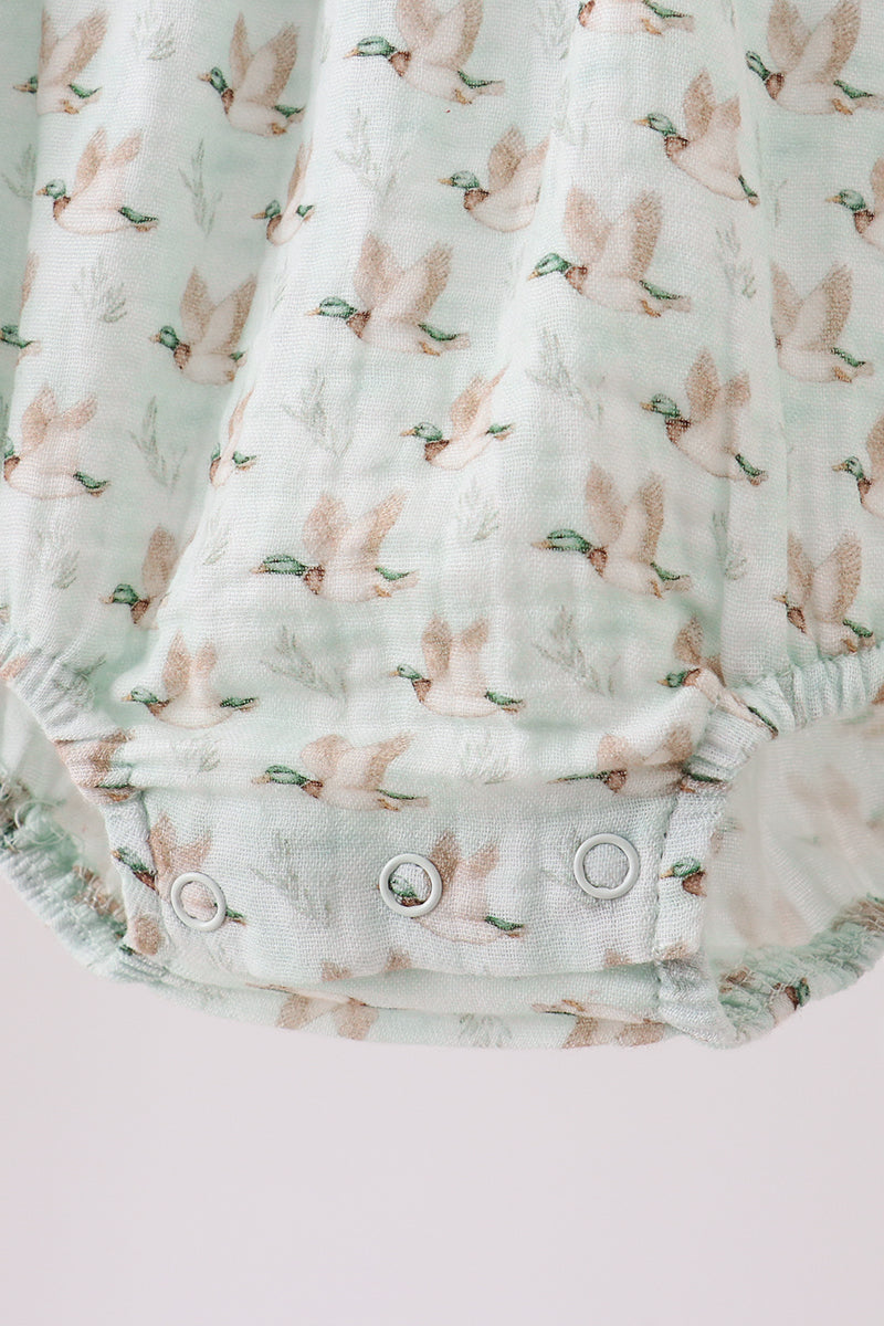 Baby romper with bunny print on a light background