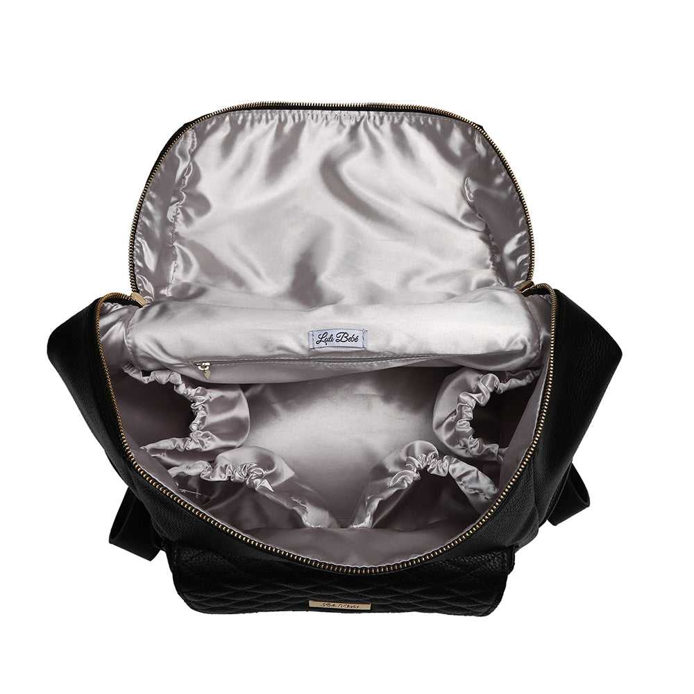 Open black backpack with silver interior on a white background