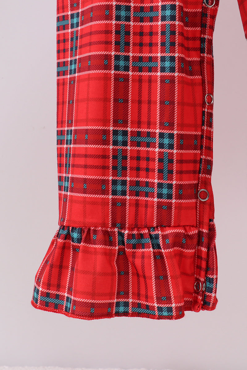 Red plaid dress with a ruffled bottom on a light gray background