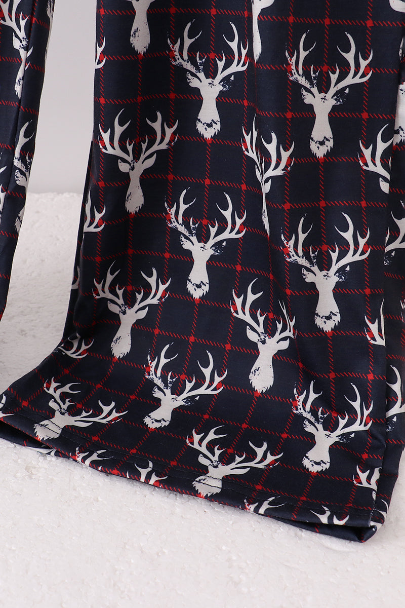 Flannel fabric with deer head pattern on a white background