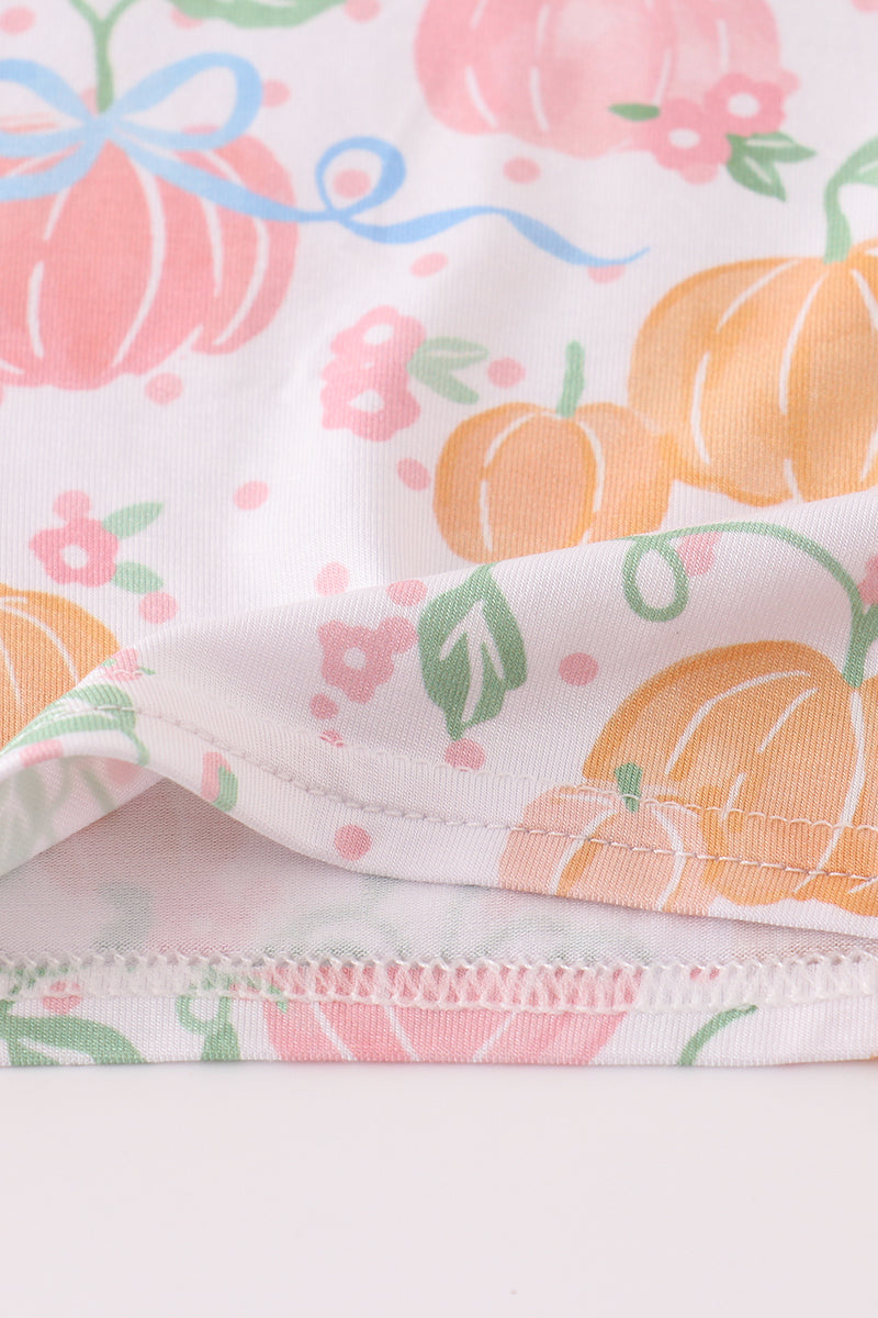 Fabric with pumpkins and flowers pattern on a white background
