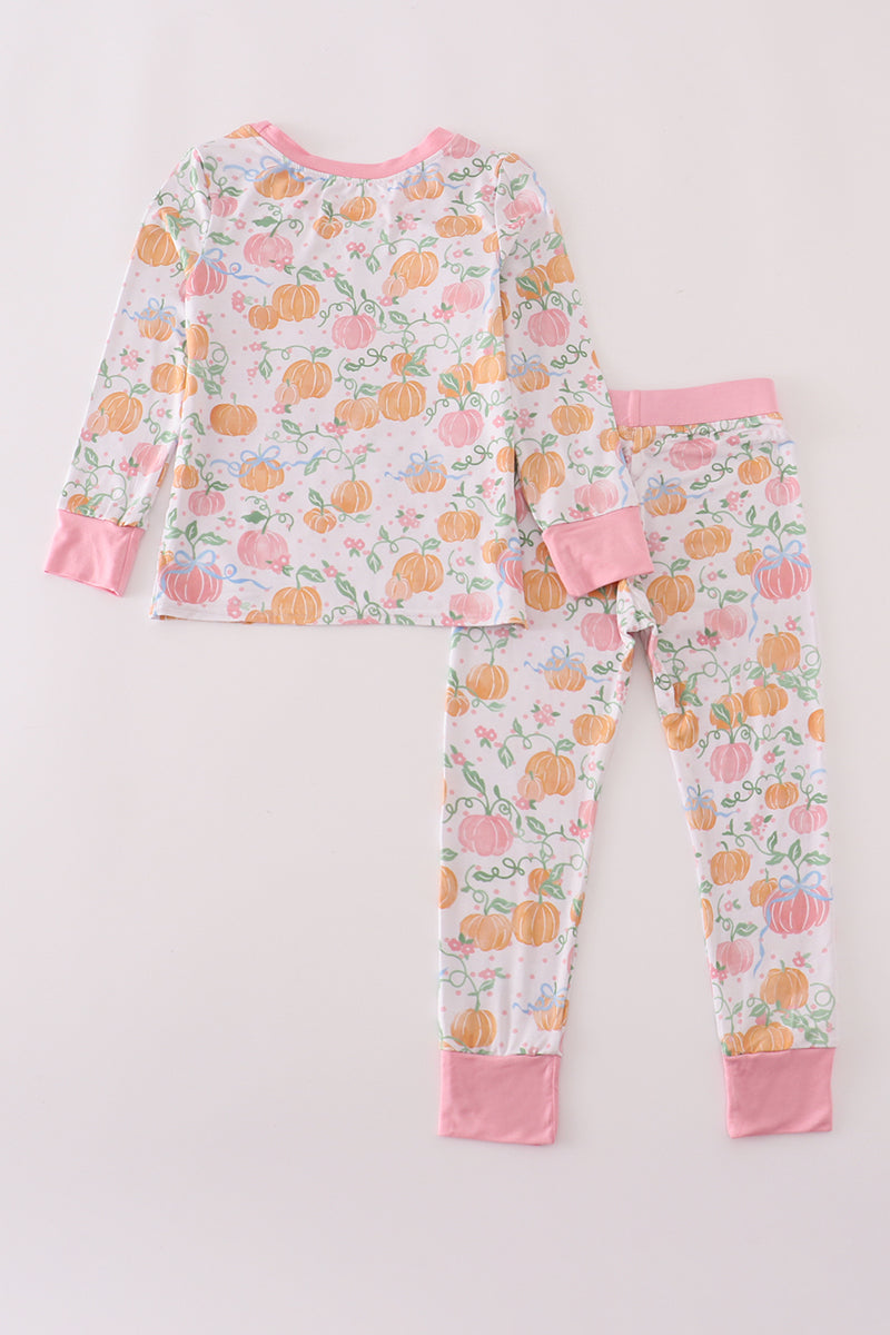 Children's pajama set with pumpkin pattern on a white background