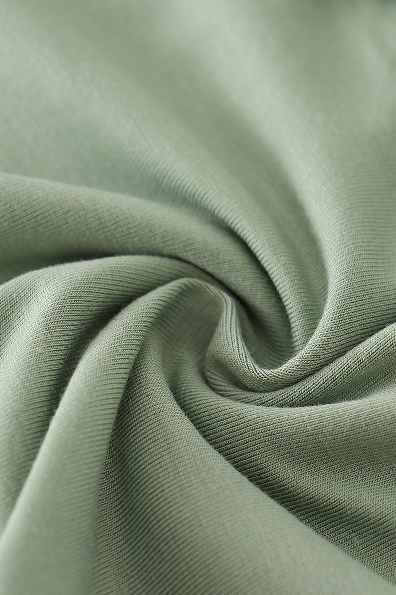 Close-up of green fabric with folds