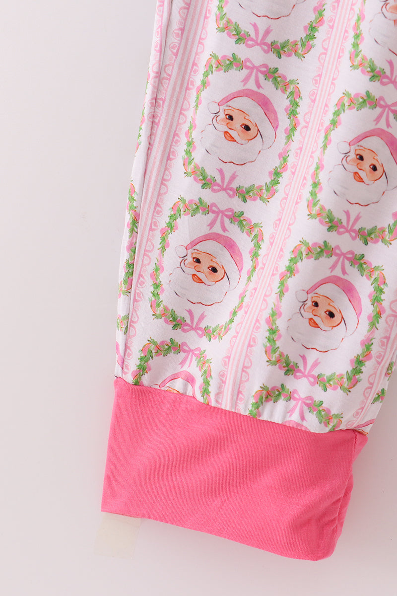 Fabric with a pattern of cartoon characters in pink hats and bows on a white background.
