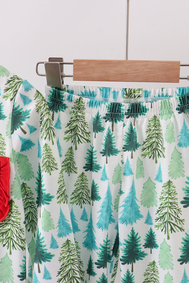 Skirt with tree pattern on a hanger against a white background