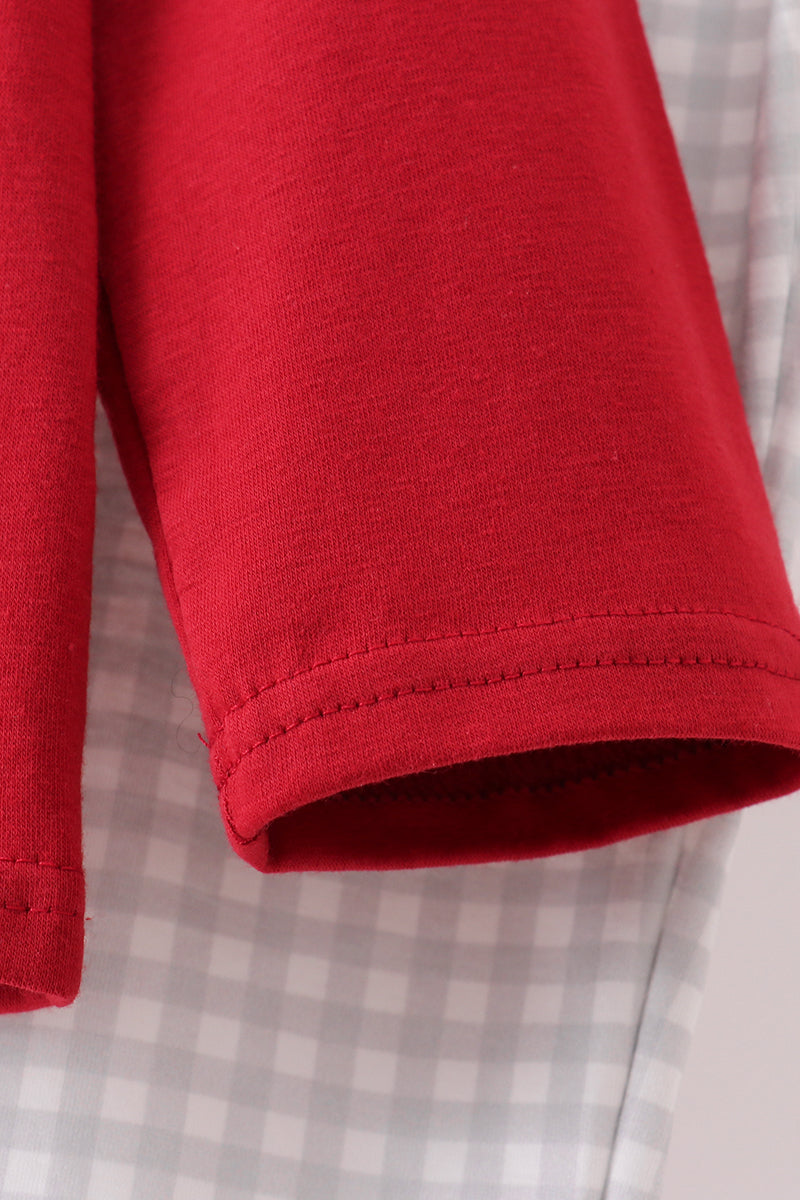 Close-up of a red fabric edge on a checkered background