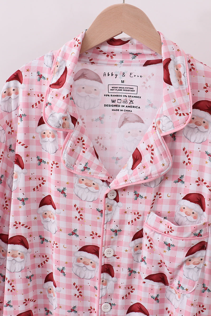 Pink checkered shirt with Santa Claus pattern on a hanger
