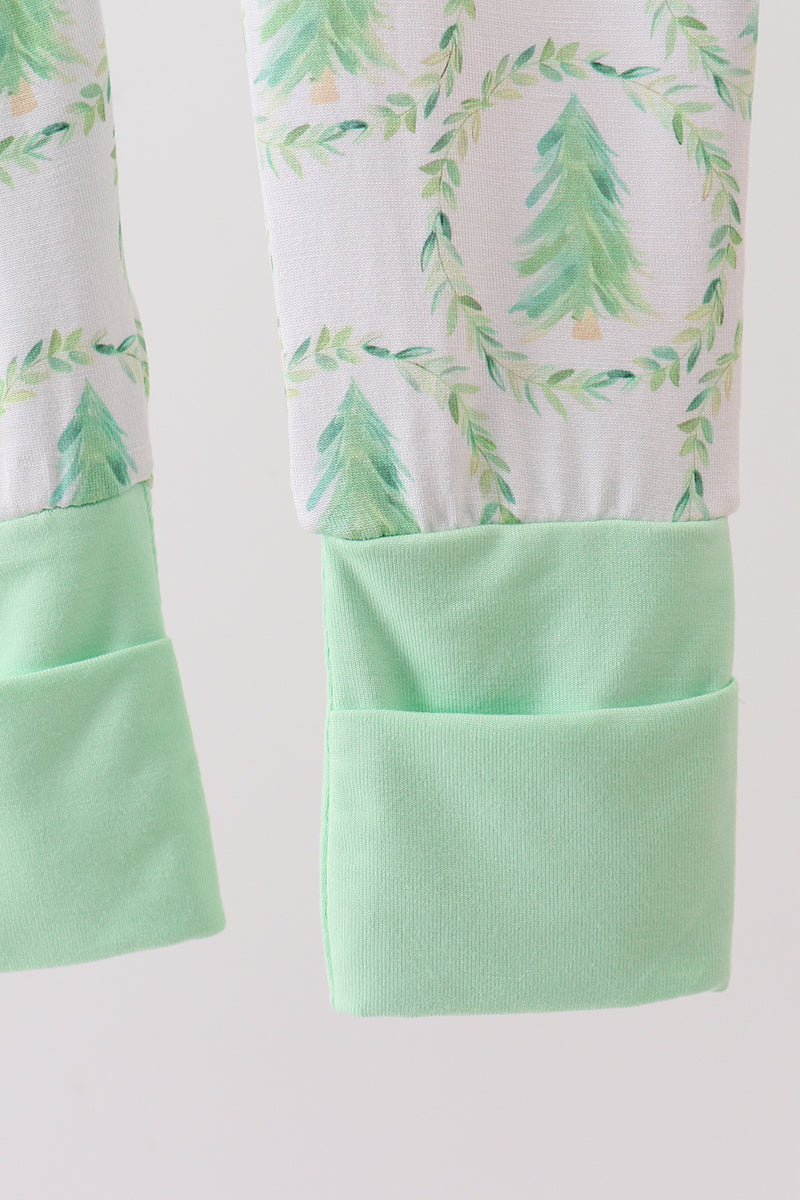 Pajama pants with green tree pattern and pocket on a white background