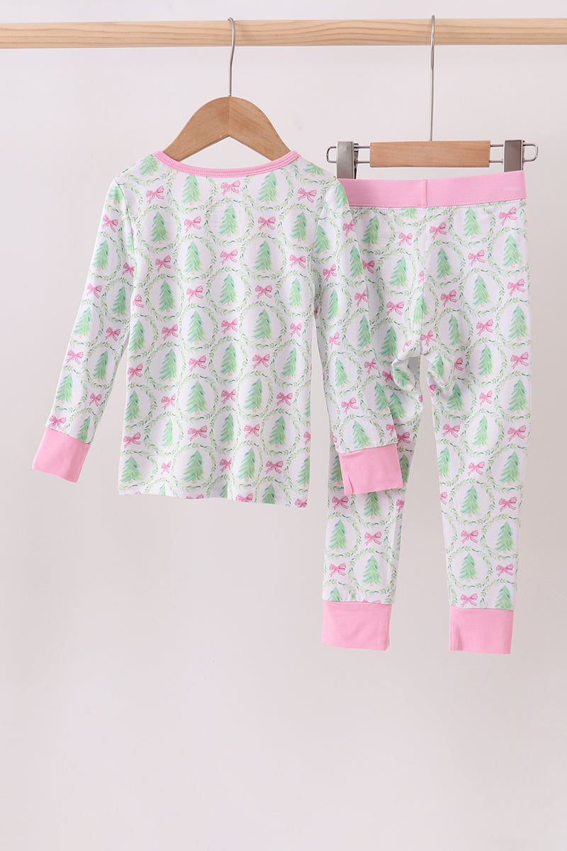 Children's pajama set with cactus pattern on a hanger against a white background