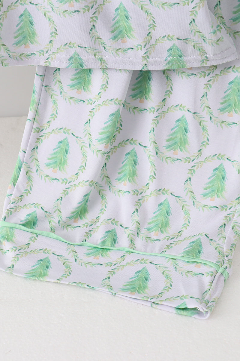 White fabric with green tree pattern on a white background