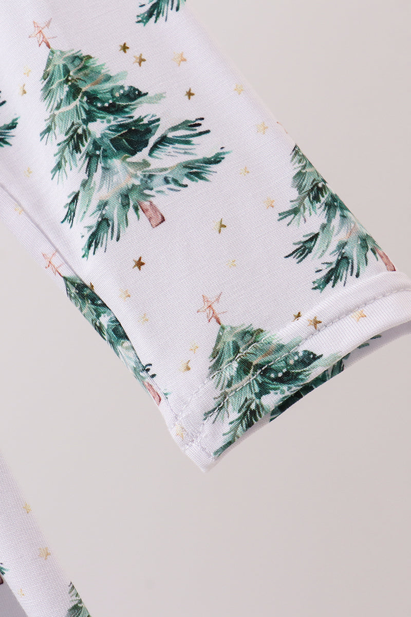 White fabric with green pine tree and gold star pattern