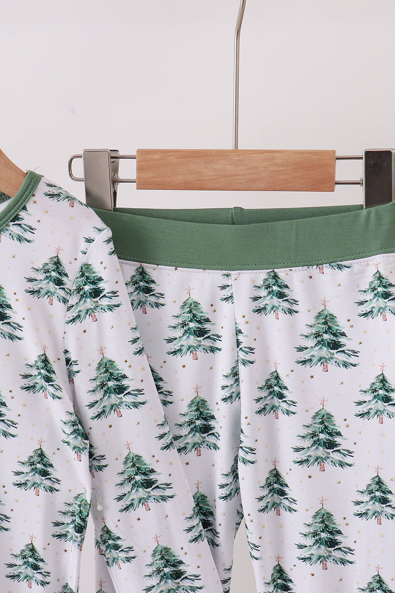 Green belt on a white garment with tree pattern, hanging on a rack.