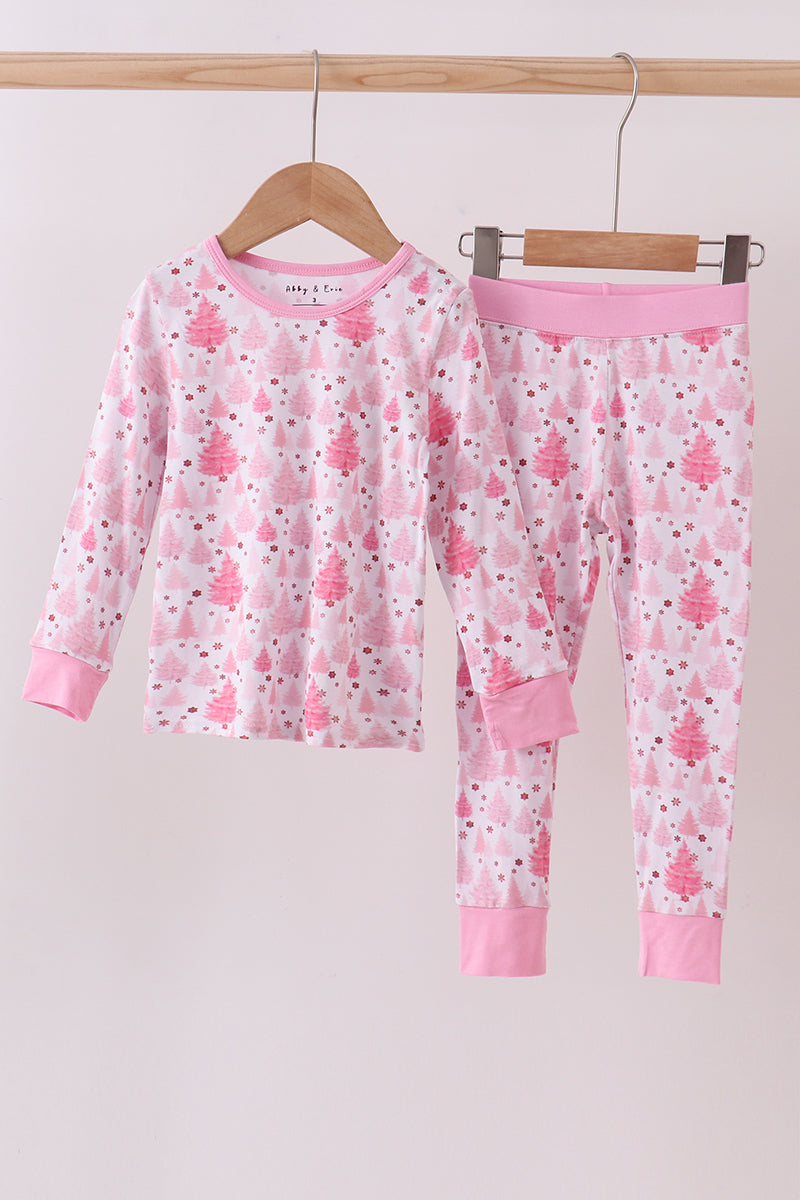 Children's pink pajama set with floral pattern on a hanger against a white background