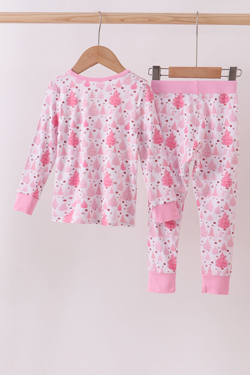 Children's pink pajama set with floral pattern on a hanger against a white background
