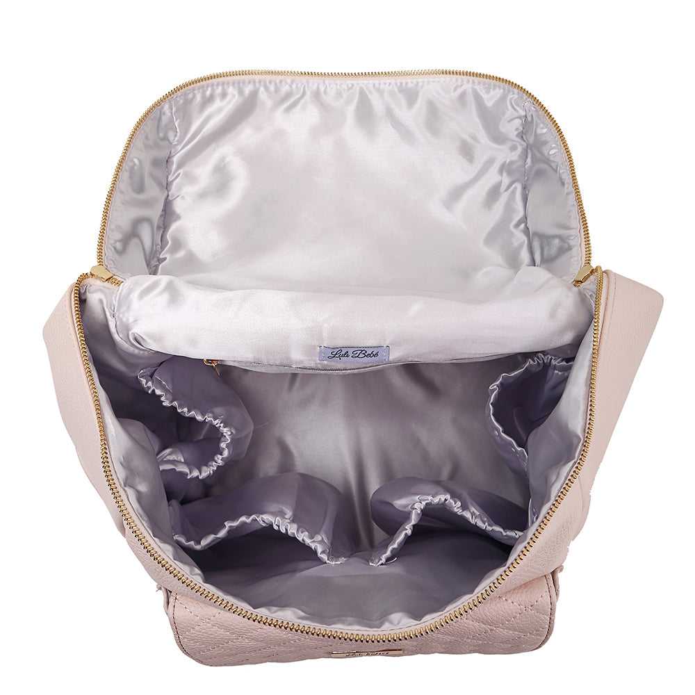 Open pink bag with gray interior and visible brand label on a white background