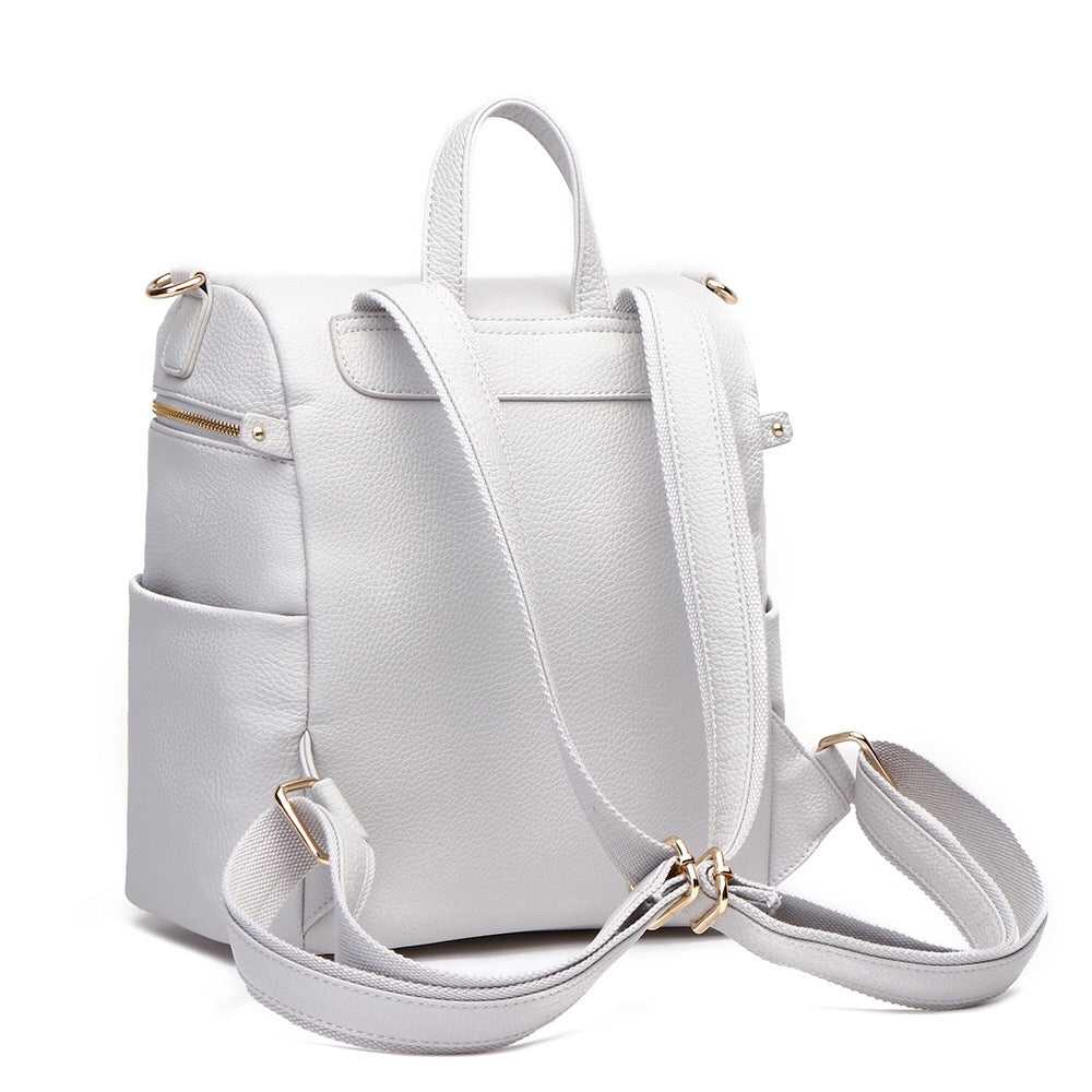 White backpack with gold zippers on a white background