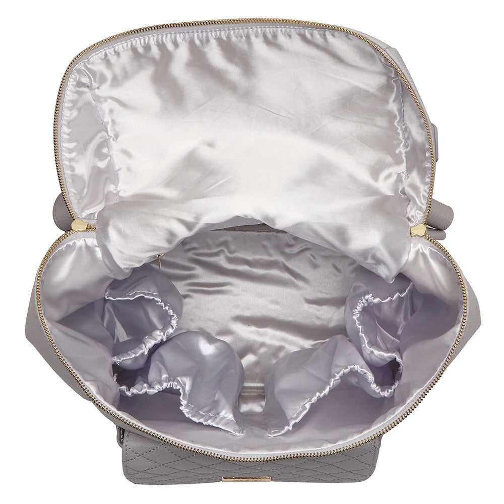 Open gray jewelry box with a white interior and ruffled lining.