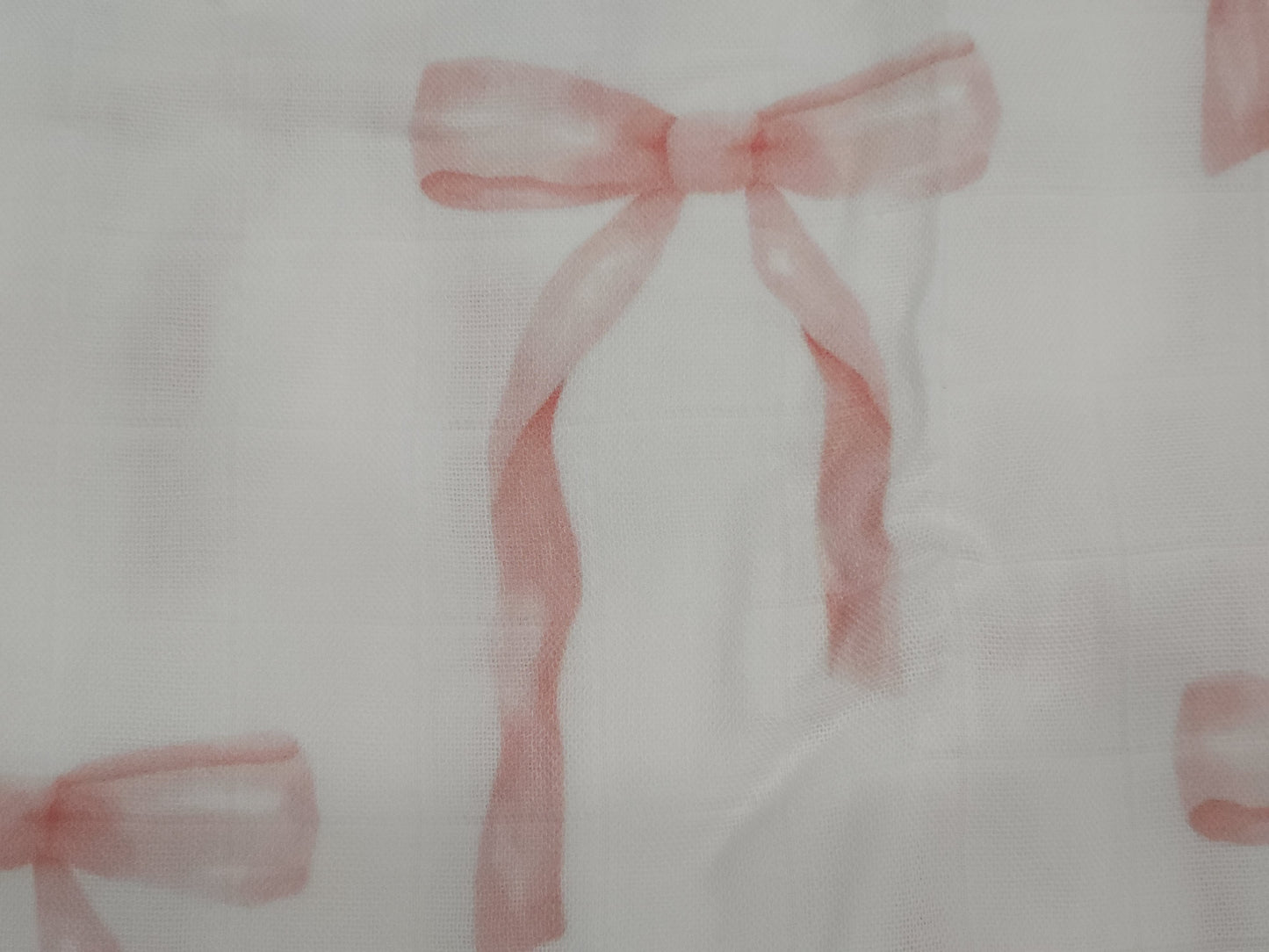 Pink ribbons on a white background