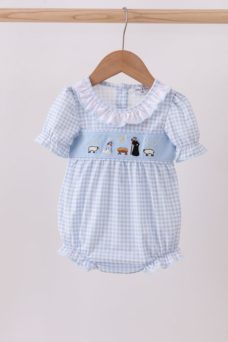 Baby romper with blue checkered pattern and cartoon characters on a hanger against a light background