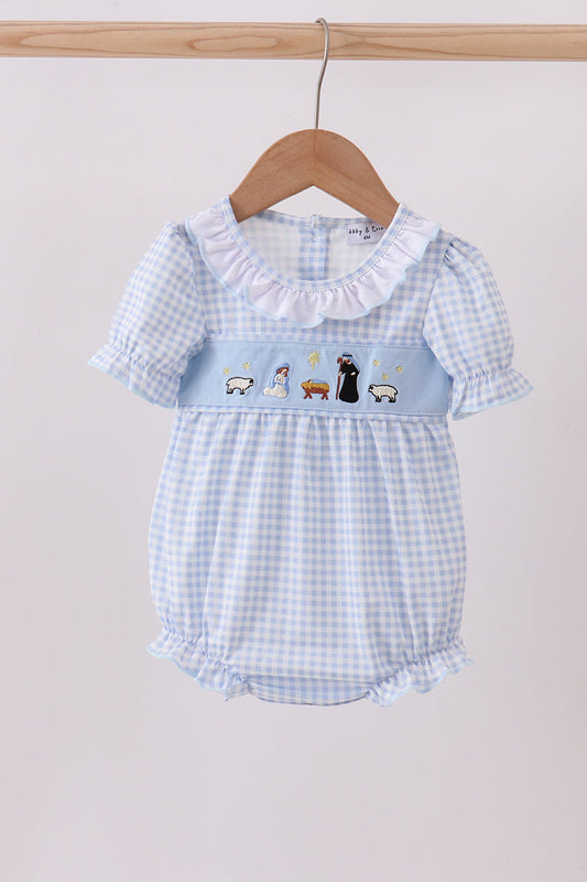 Baby romper with blue checkered pattern and cartoon characters on a hanger against a light background