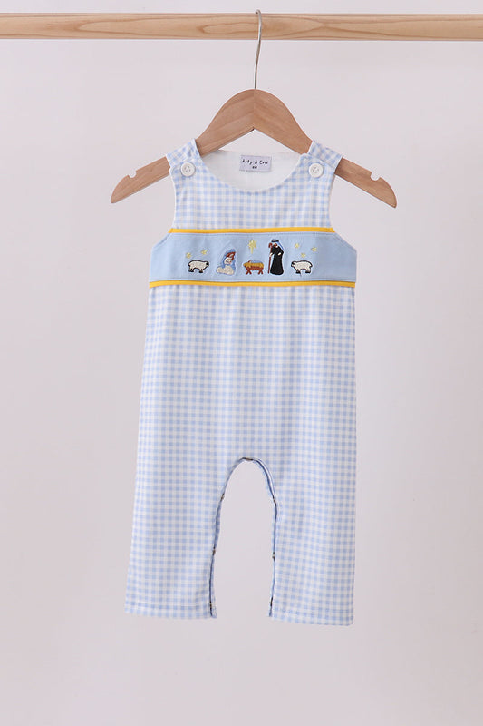 Baby romper with checkered pattern and embroidered design on a hanger against a light background