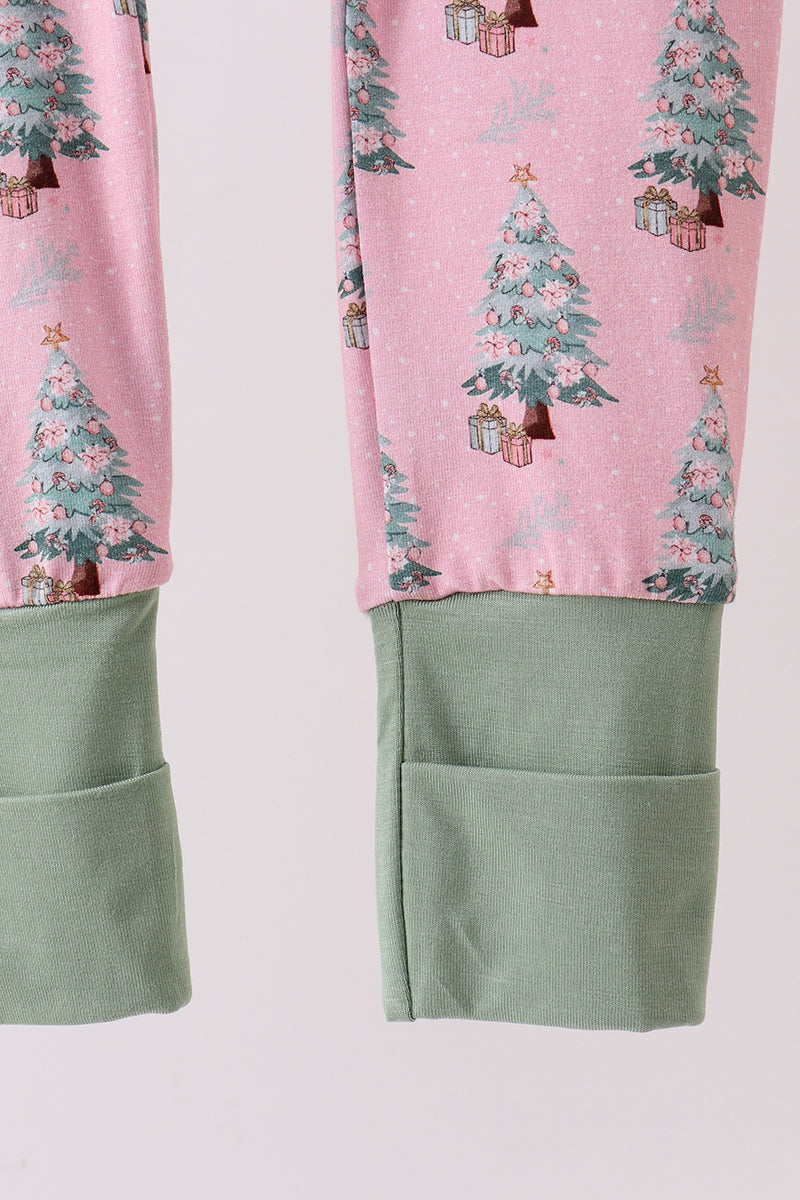 Pink pajama pants with Christmas tree and gift print on a light pink background