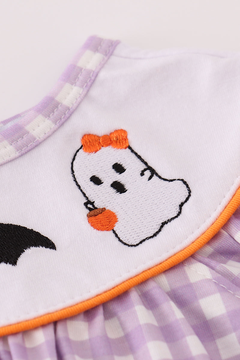 Children's bib with ghost design and purple checkered pattern