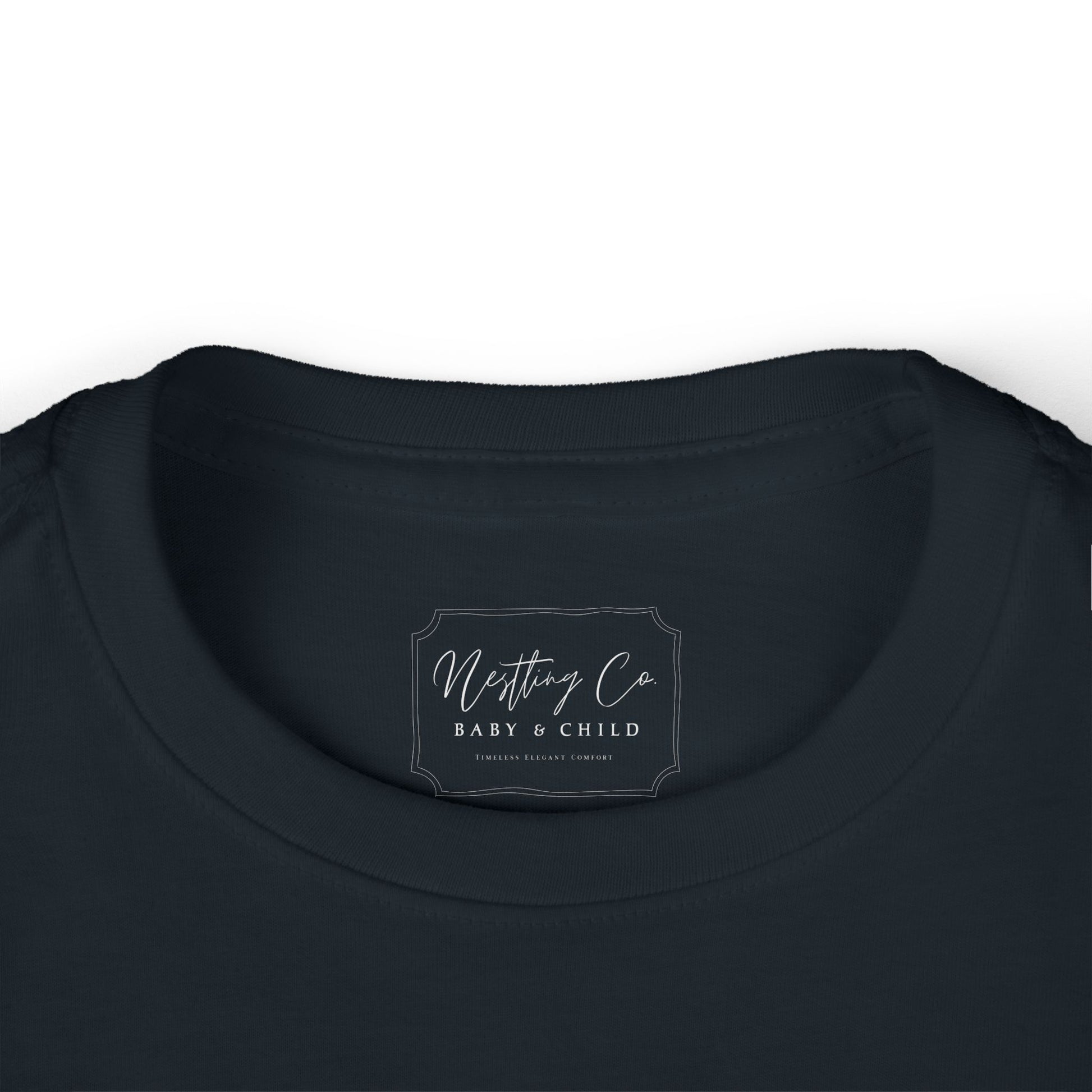 Nesting Co baby & child label on a black garment