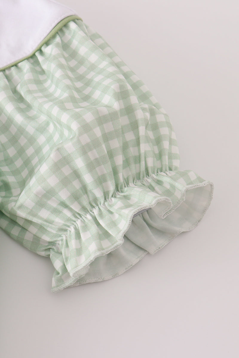 Green checkered fabric on a white background