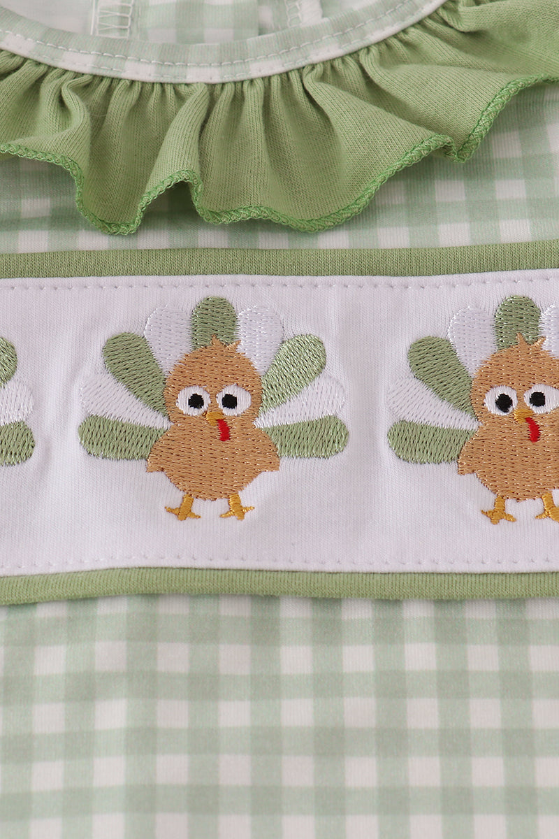 Green checkered fabric with embroidered turkeys and ruffled trim