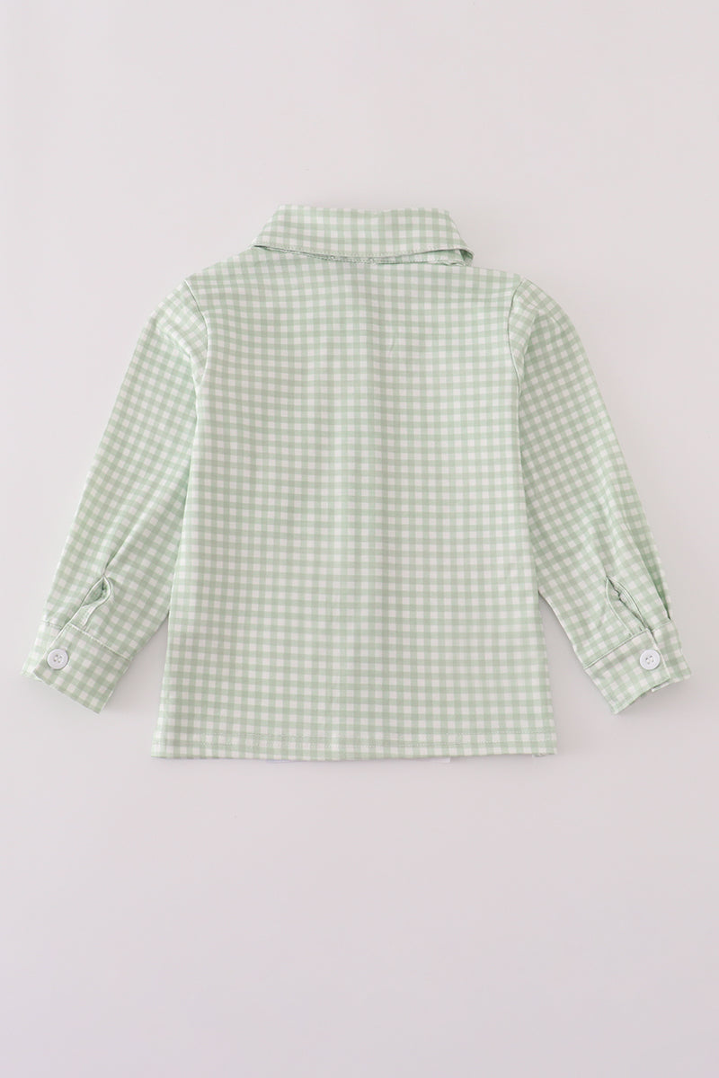 Green checkered shirt on a light gray background