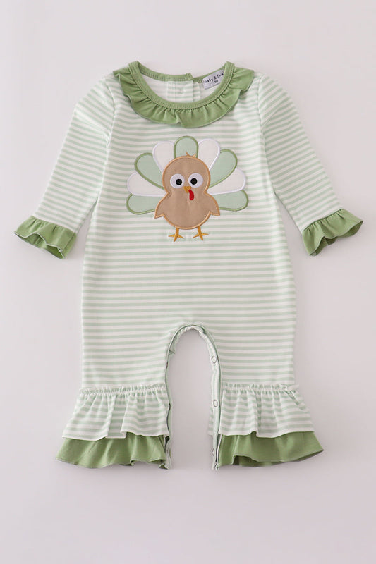 Striped baby romper with a turkey design on a light gray background